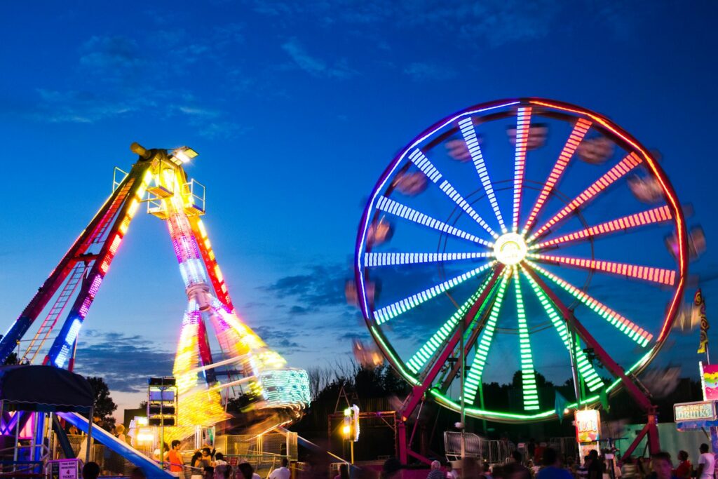 Ferris wheel lit up at night at the fair, Carolina Classic Fair tips for kids with braces in Winston-Salem